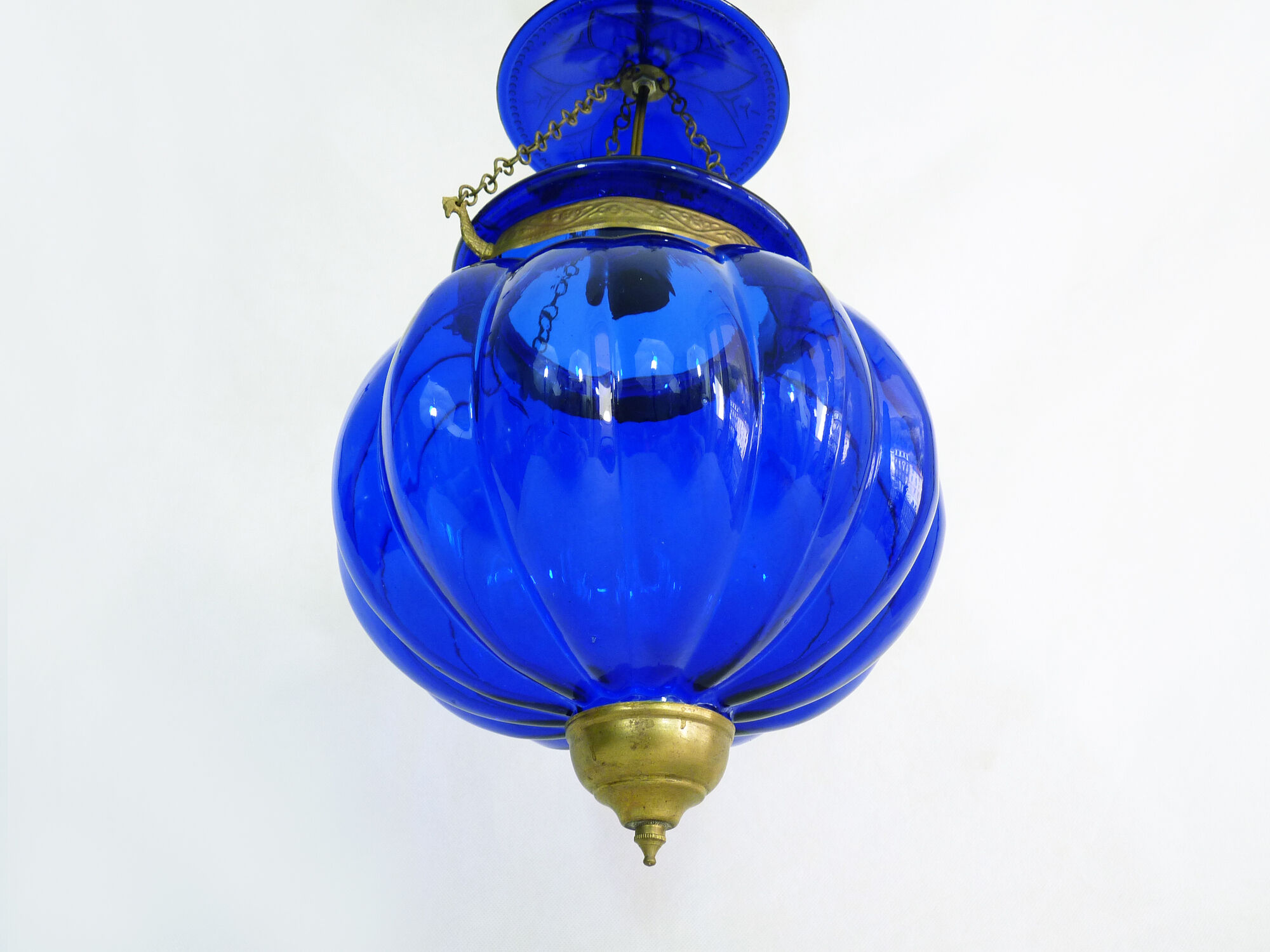 Suspension chandelier, oriental blue glass lantern and brass structure. Year 70-80