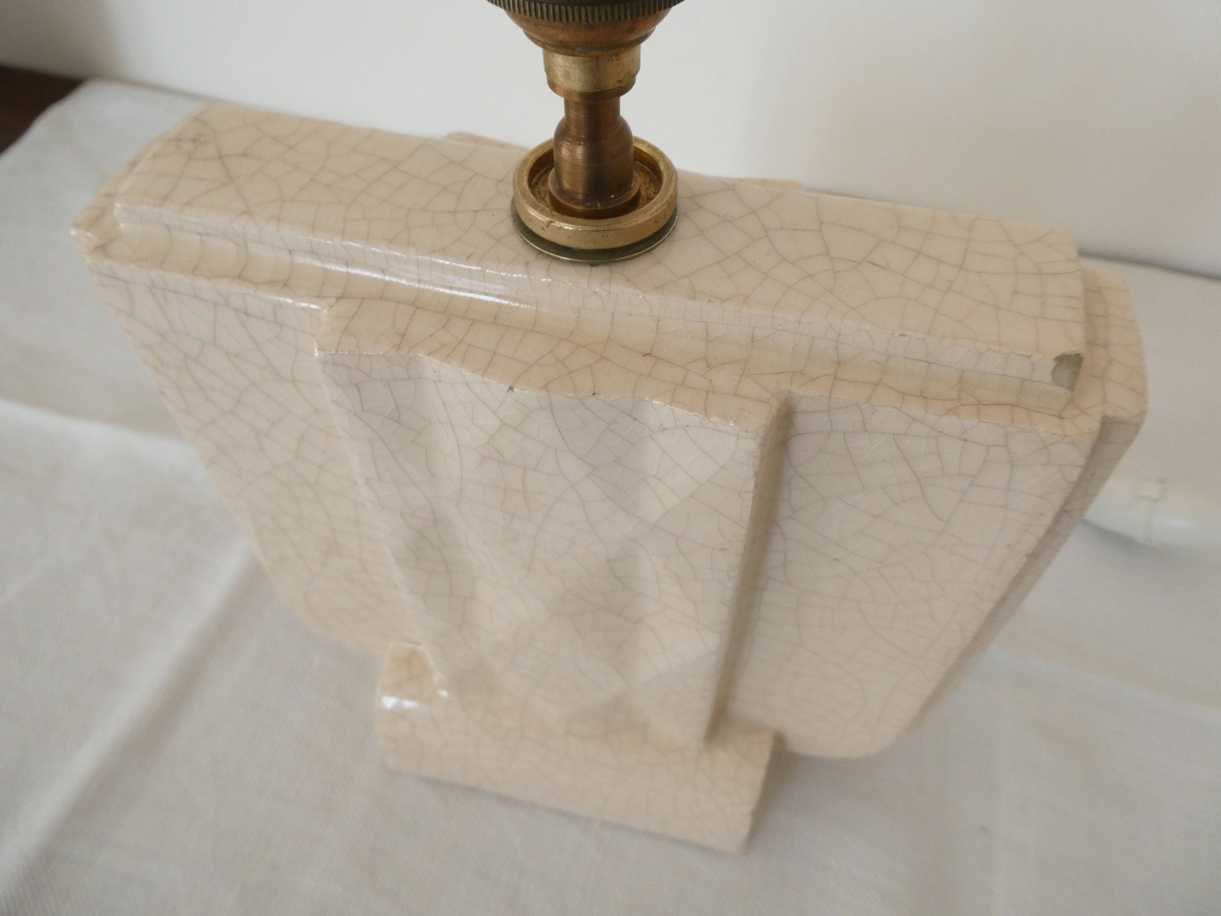 Cream cracked ceramic lamp base in Scandinavian style.