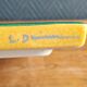 Yellow glazed ceramic trivet signed l. drimmer