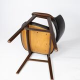Armchair in rosewood and black leather of danish design from 1976.
