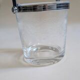 Clear glass ice bucket with an etched floral design