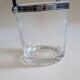 Clear glass ice bucket with an etched floral design