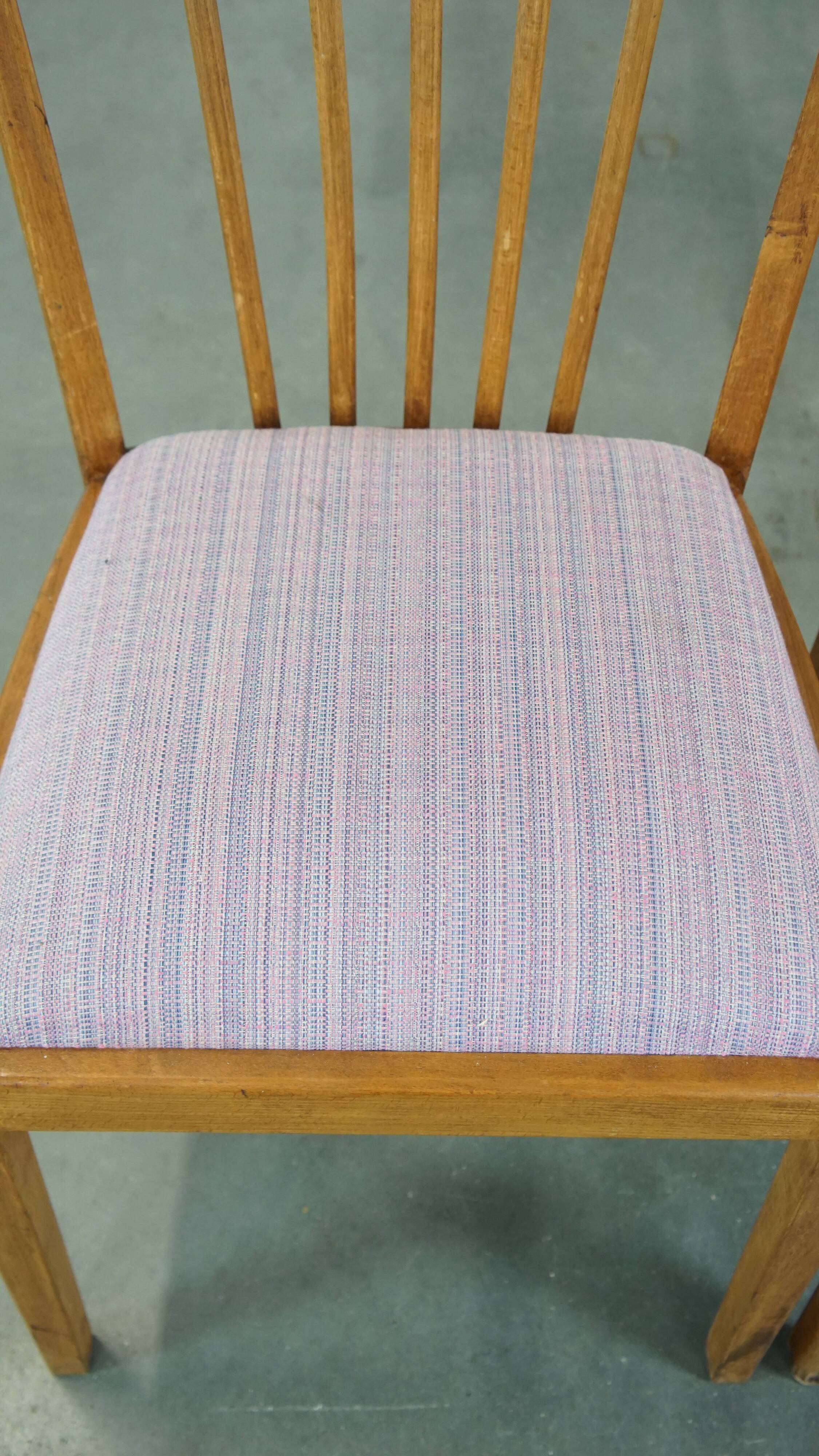 Set of 2 vintage dining chairs from the 1970s with spindle backrest and fabric seat