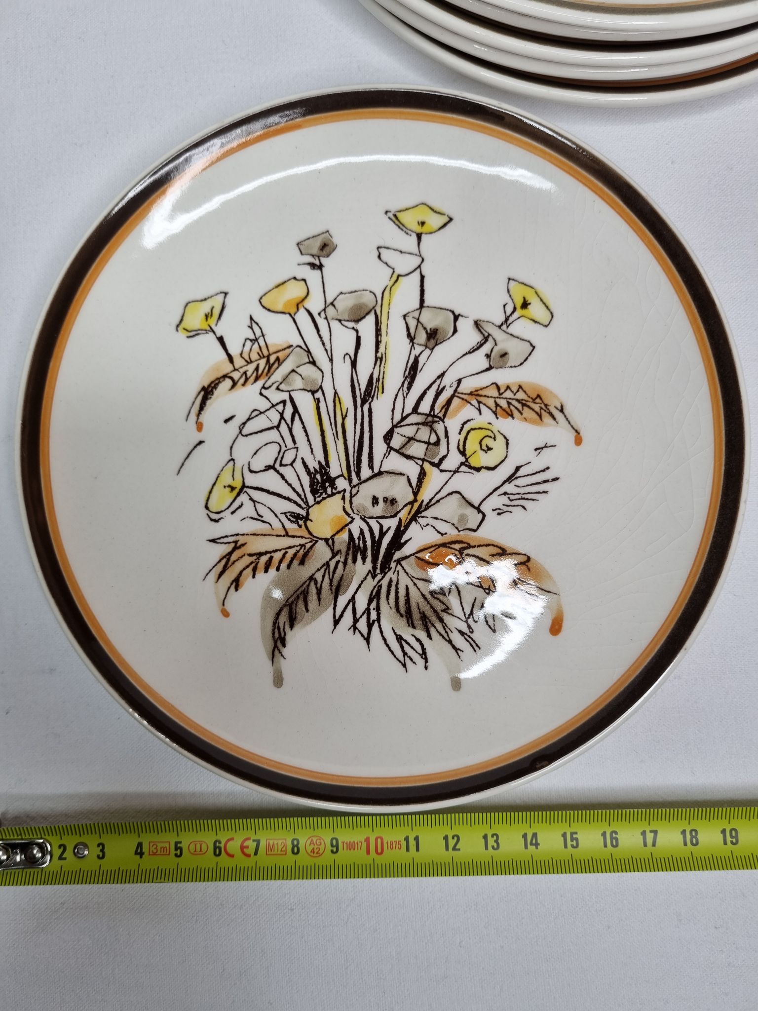 Six vintage dessert plates decorated with flowers from the Gien earthenware factory