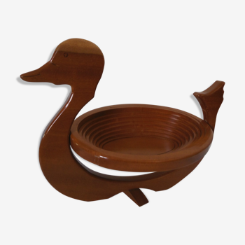 Fruit basket under flat wood duck shape