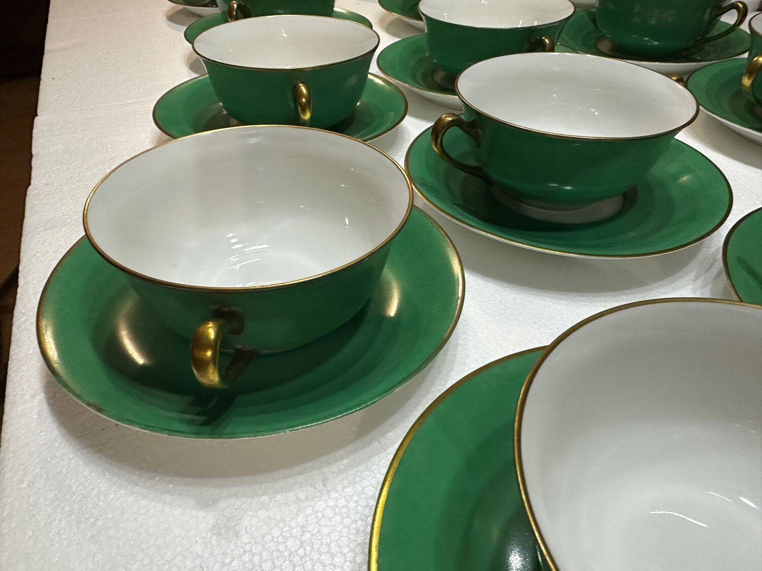 Service 14 cup and saucer in Art Deco Emerald Green and Gold.