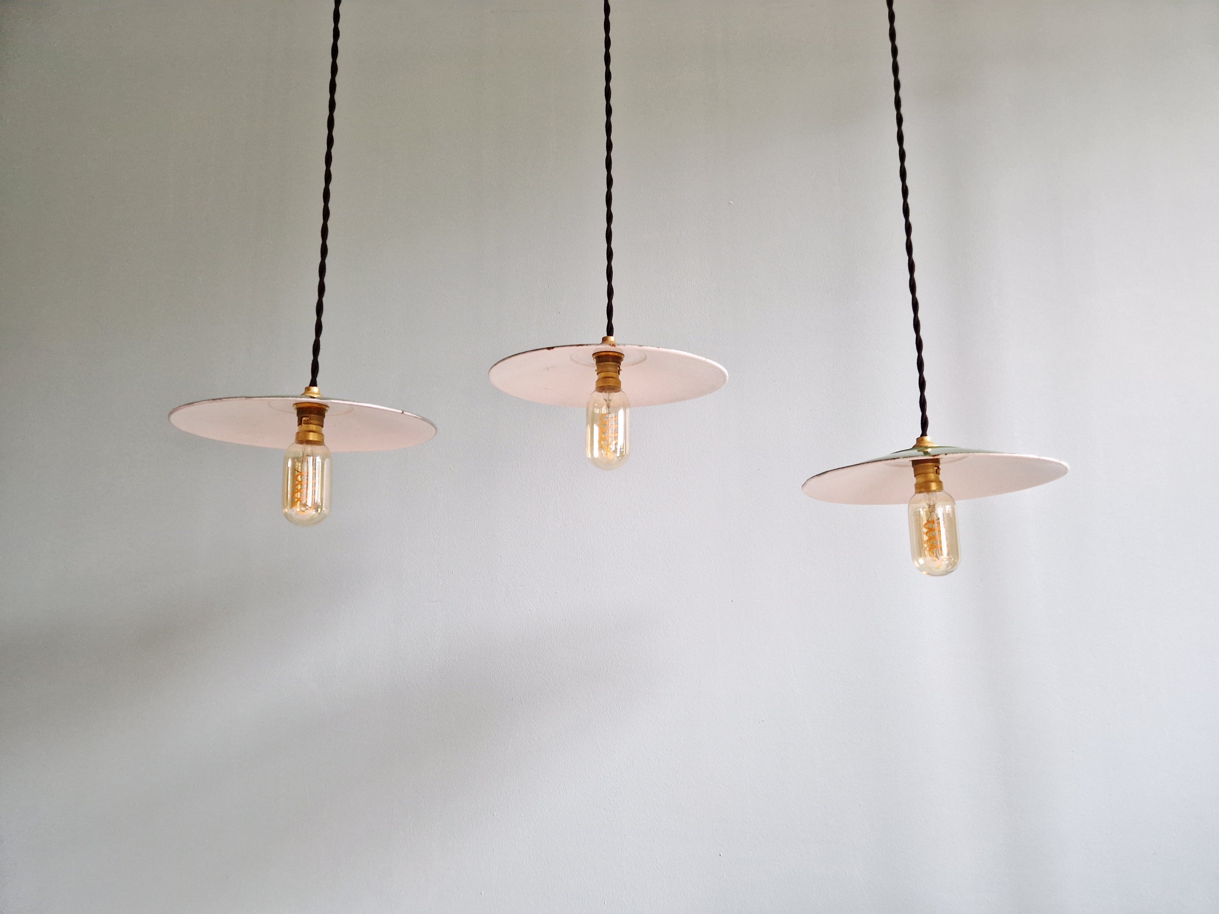 Trio of large industrial suspensions in green enamelled sheet metal.