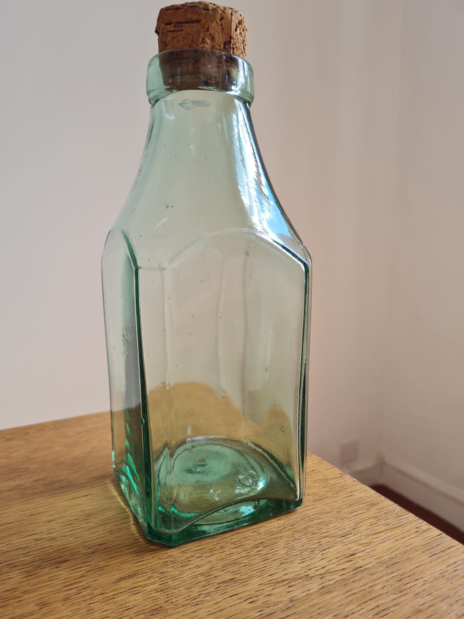 Green blown glass bottle