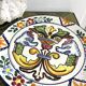 Decorative ceramic plate with griffins