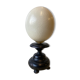 Ostrich egg on blackened wooden base