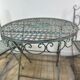 Patinated green folding wrought iron garden set with 1 table + 2 chairs.