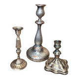 Set of three silver candle holders
