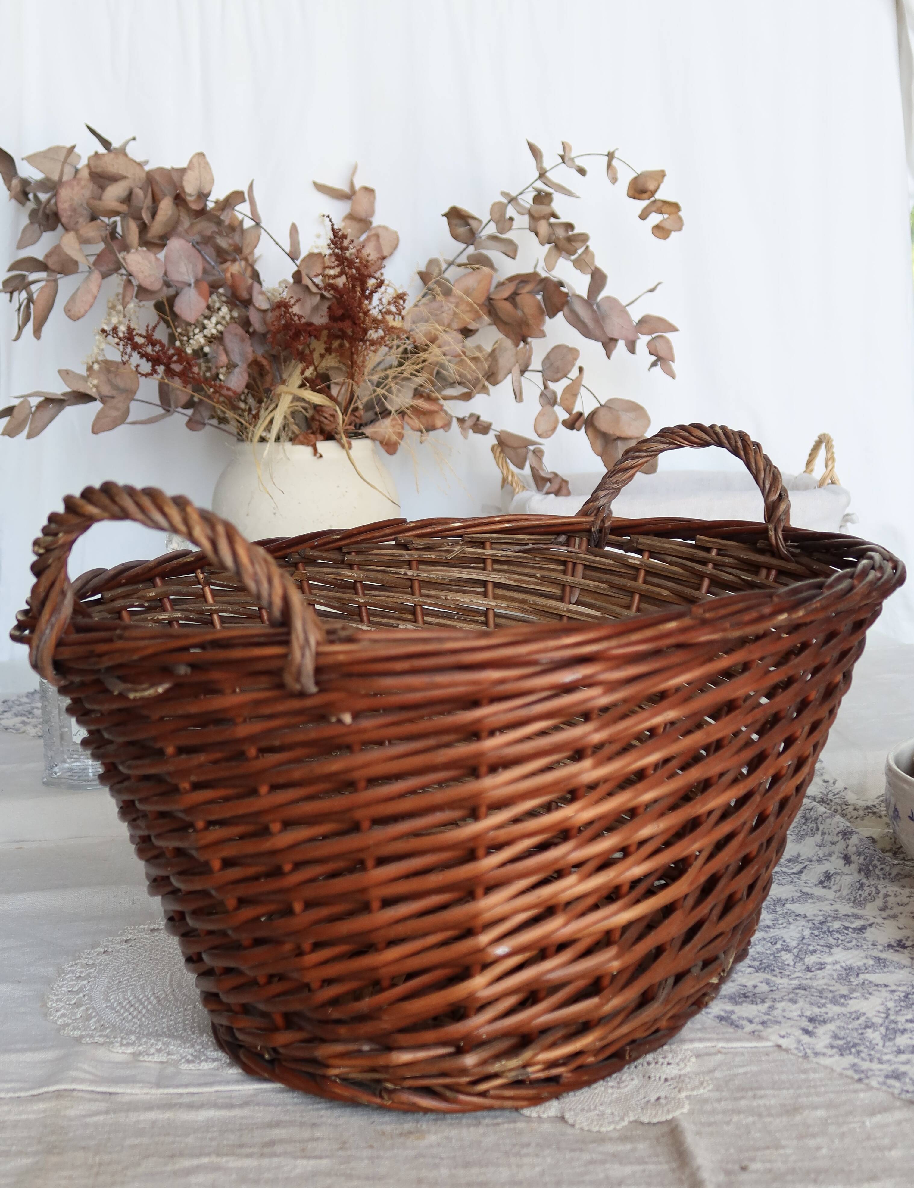 Large vintage dark wicker basket with handles