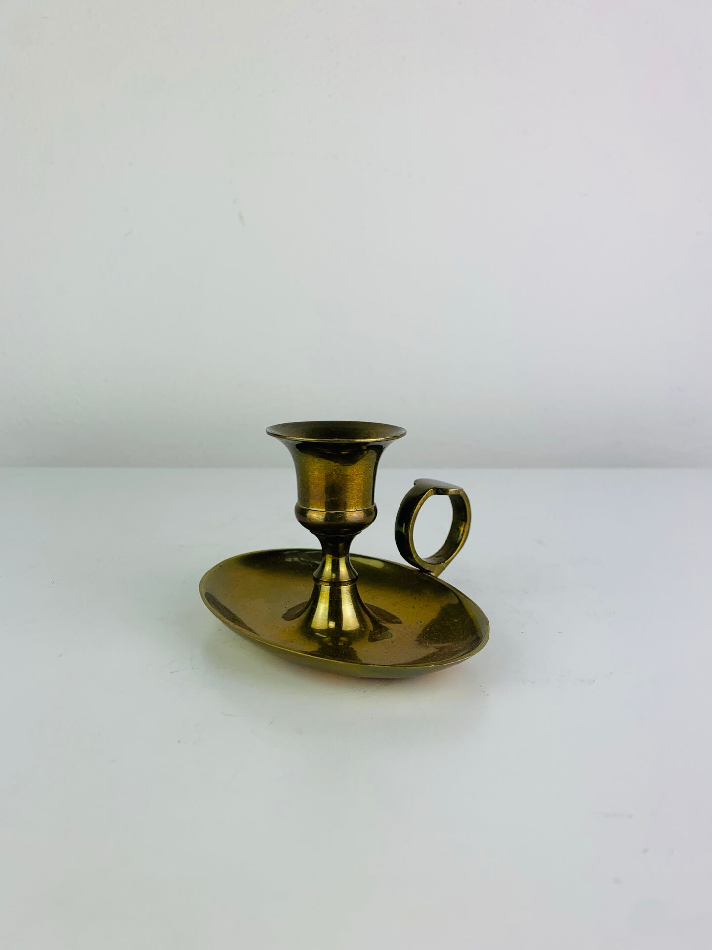 Vintage brass candlestick, rat of the cellar.