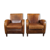Paire de fauteuils en cuir de mouton