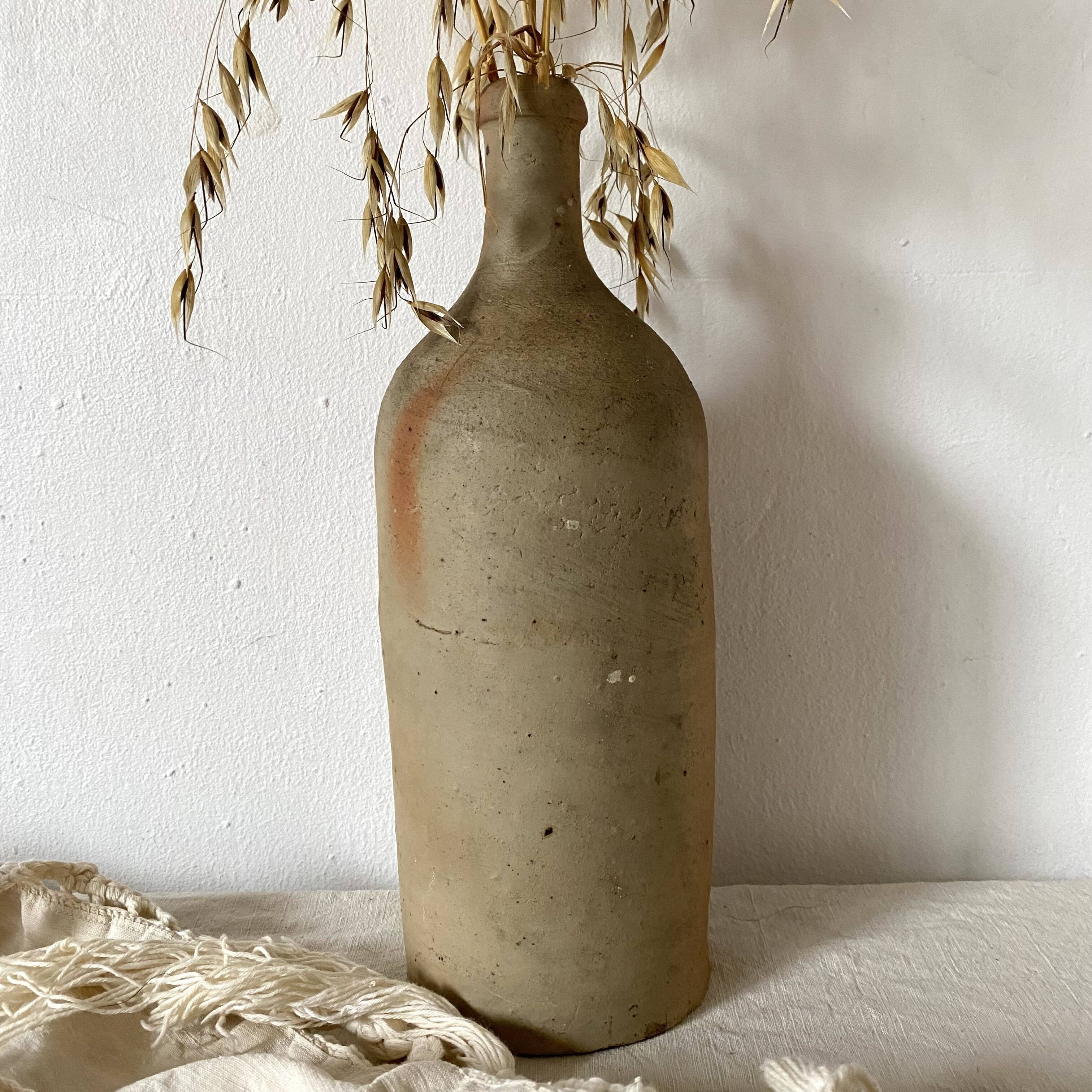 Old terracotta bottle