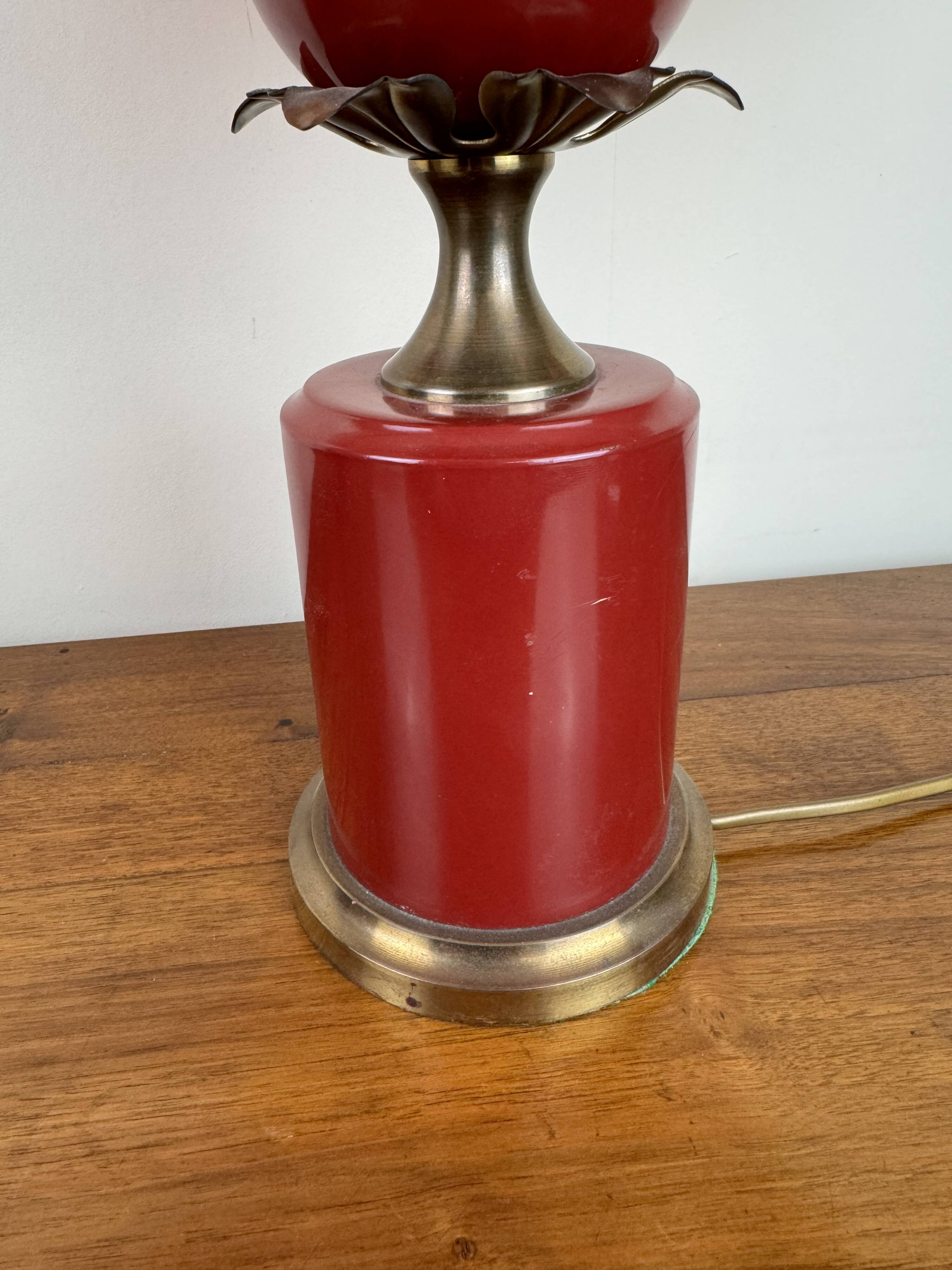 Art deco style desk lamp with a burgundy red sphere in the center the body is in lacquered iron