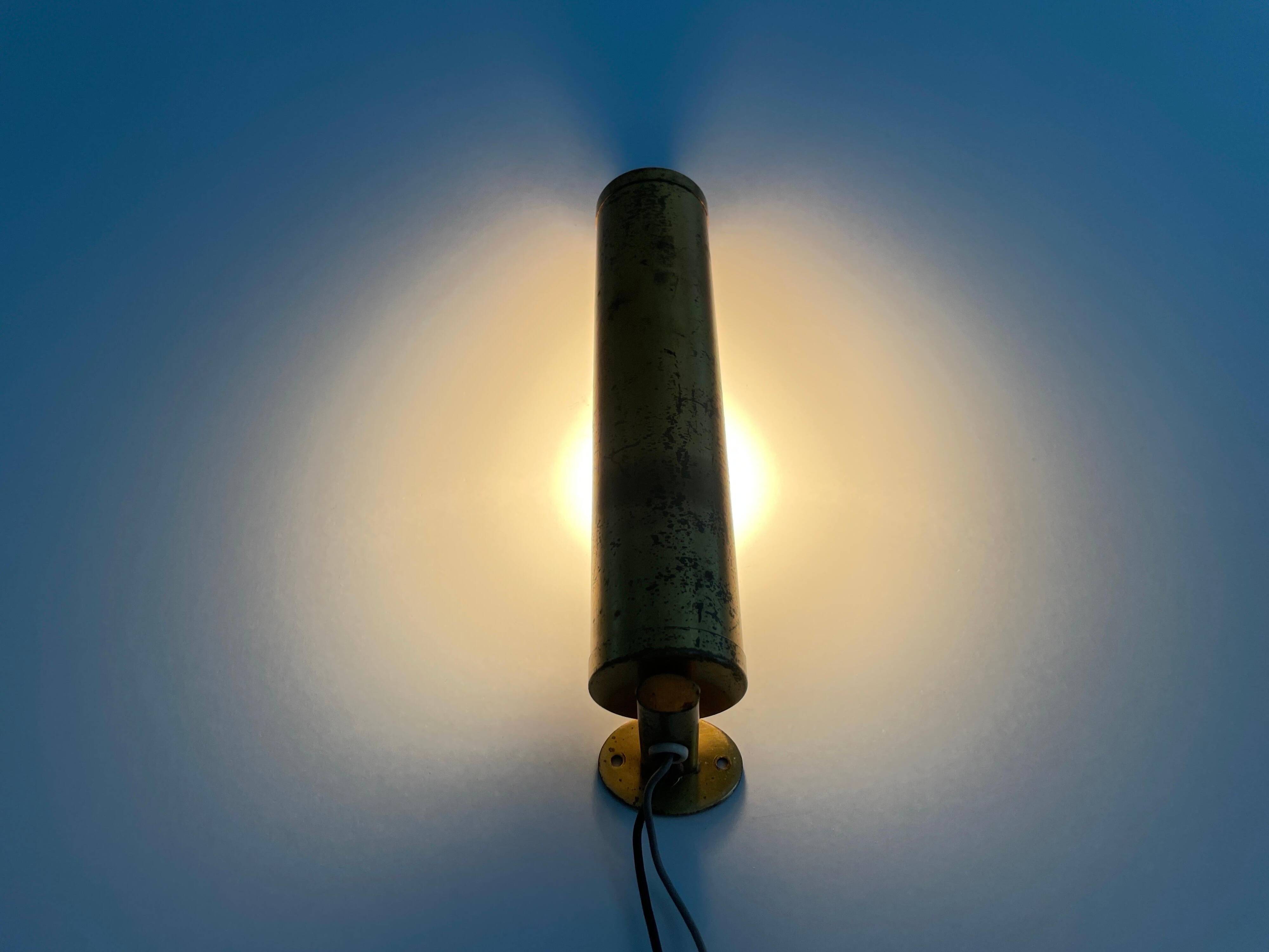 Small simple cylindrical brass wall light from the mid-century, 1950s, Germany.