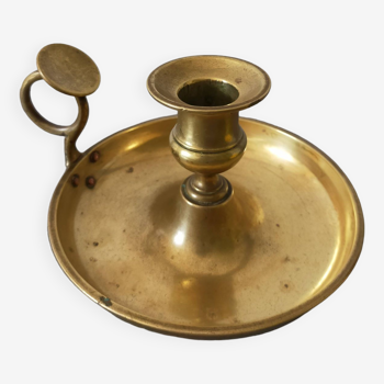 brass candle holder with old cellar rat thumb