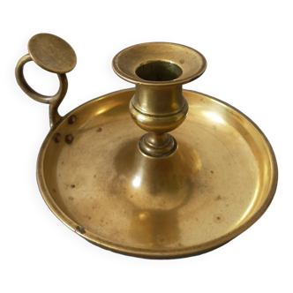 brass candle holder with old cellar rat thumb