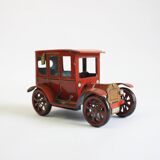 Vintage tin car with pull lever