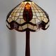 Art Deco floor lamp in carved walnut, stained glass shade, France, c. 1920
