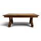 Renaissance-style oak dining table with lyre legs.