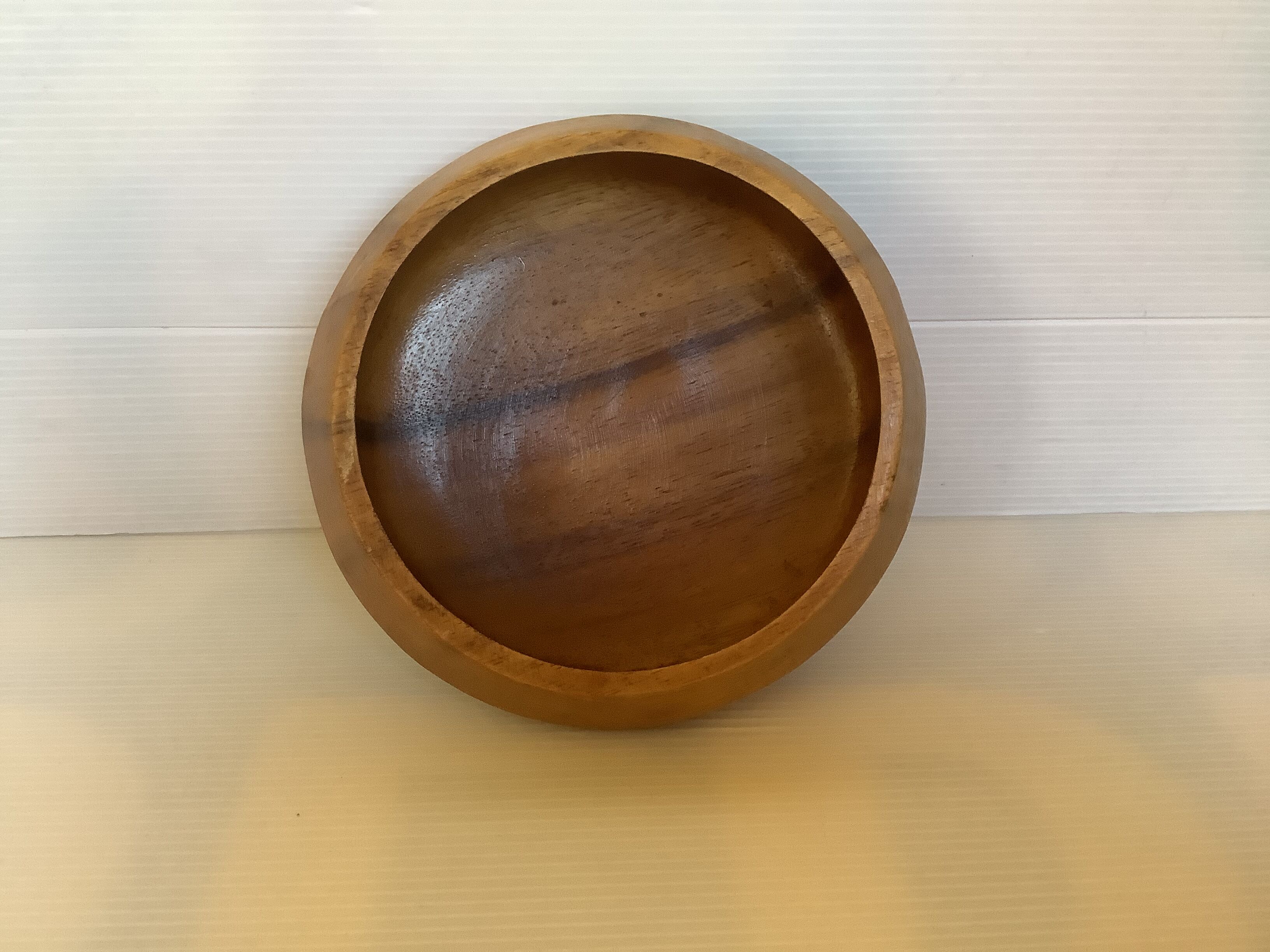 Round wooden pocket emptier