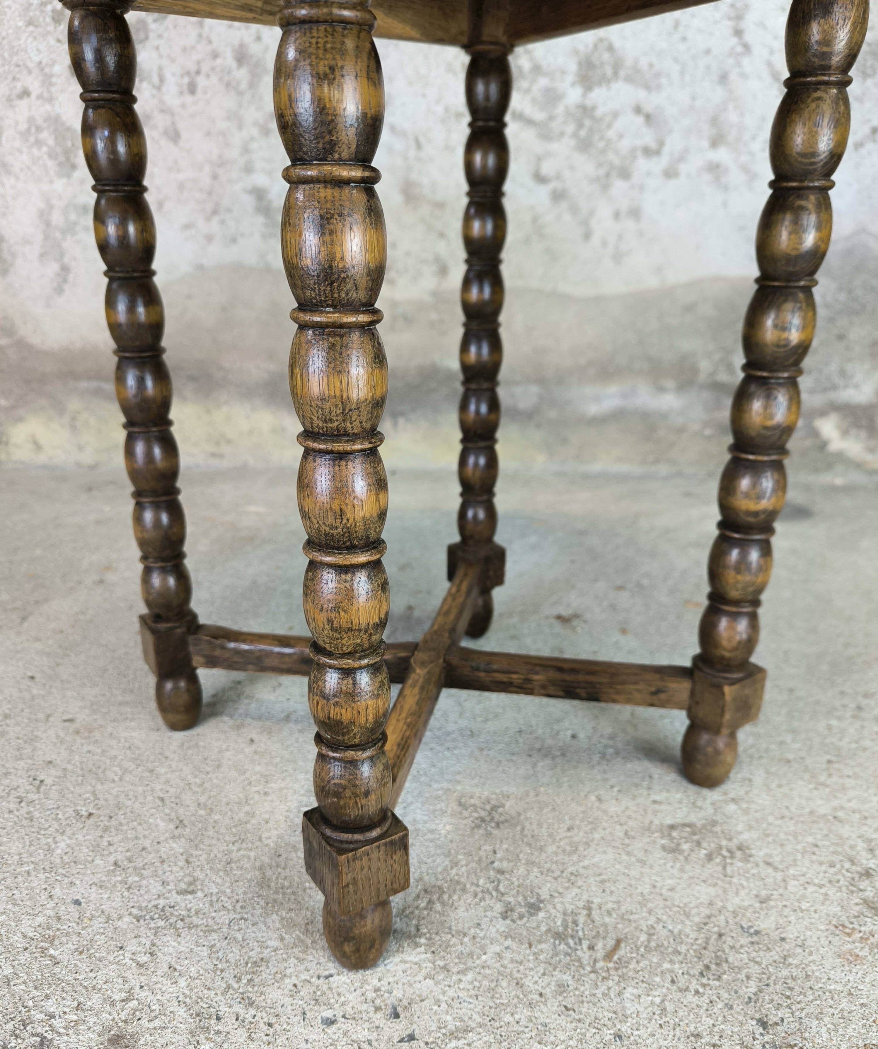 Vintage gueridon with beaded wooden legs.