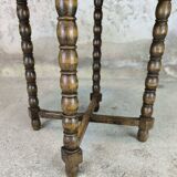 Vintage gueridon with beaded wooden legs.