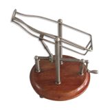 Old mechanical wine decanter on wooden base