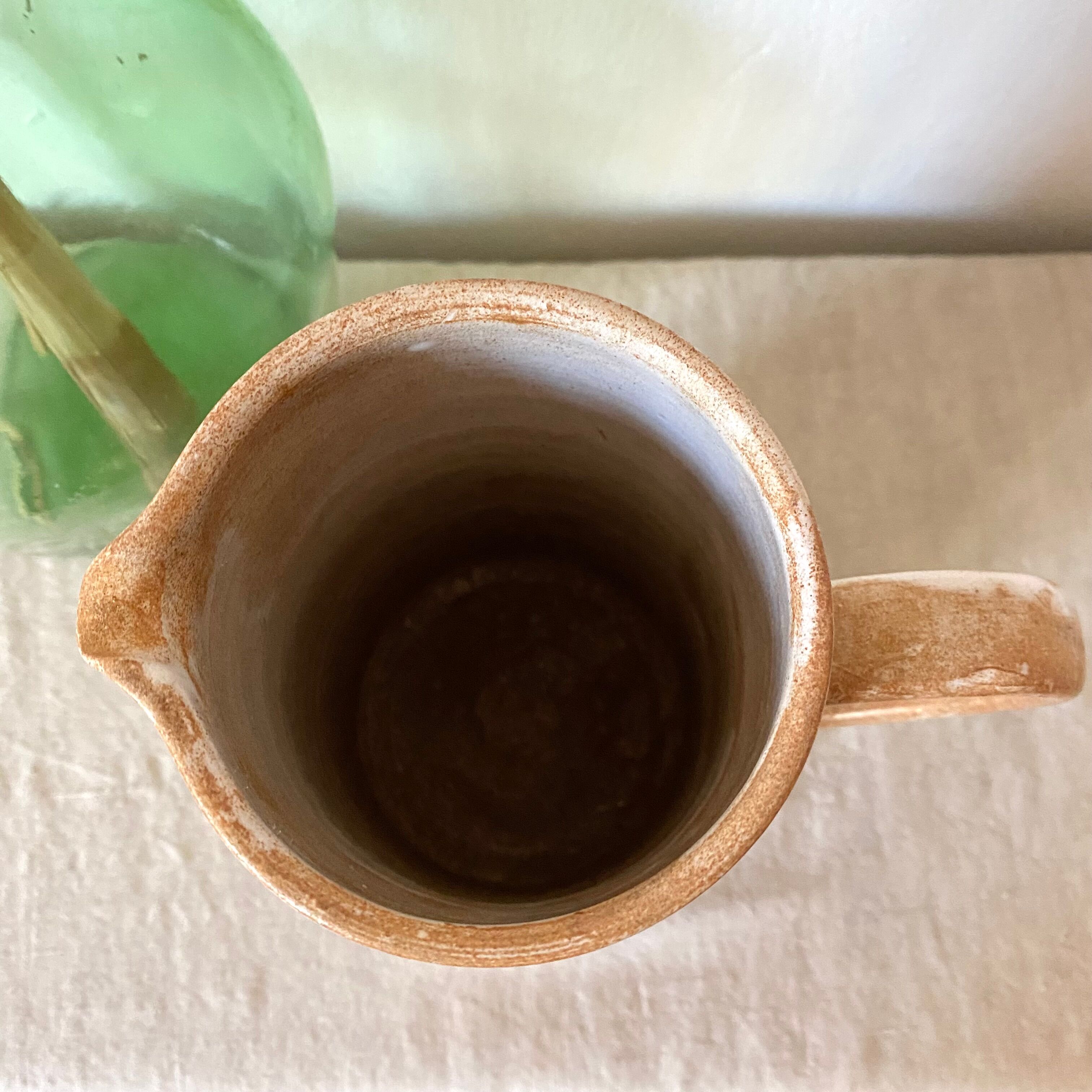 Stoneware pitcher with floral decoration