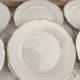 Set of 6 small white porcelain dinner plates with gold trim