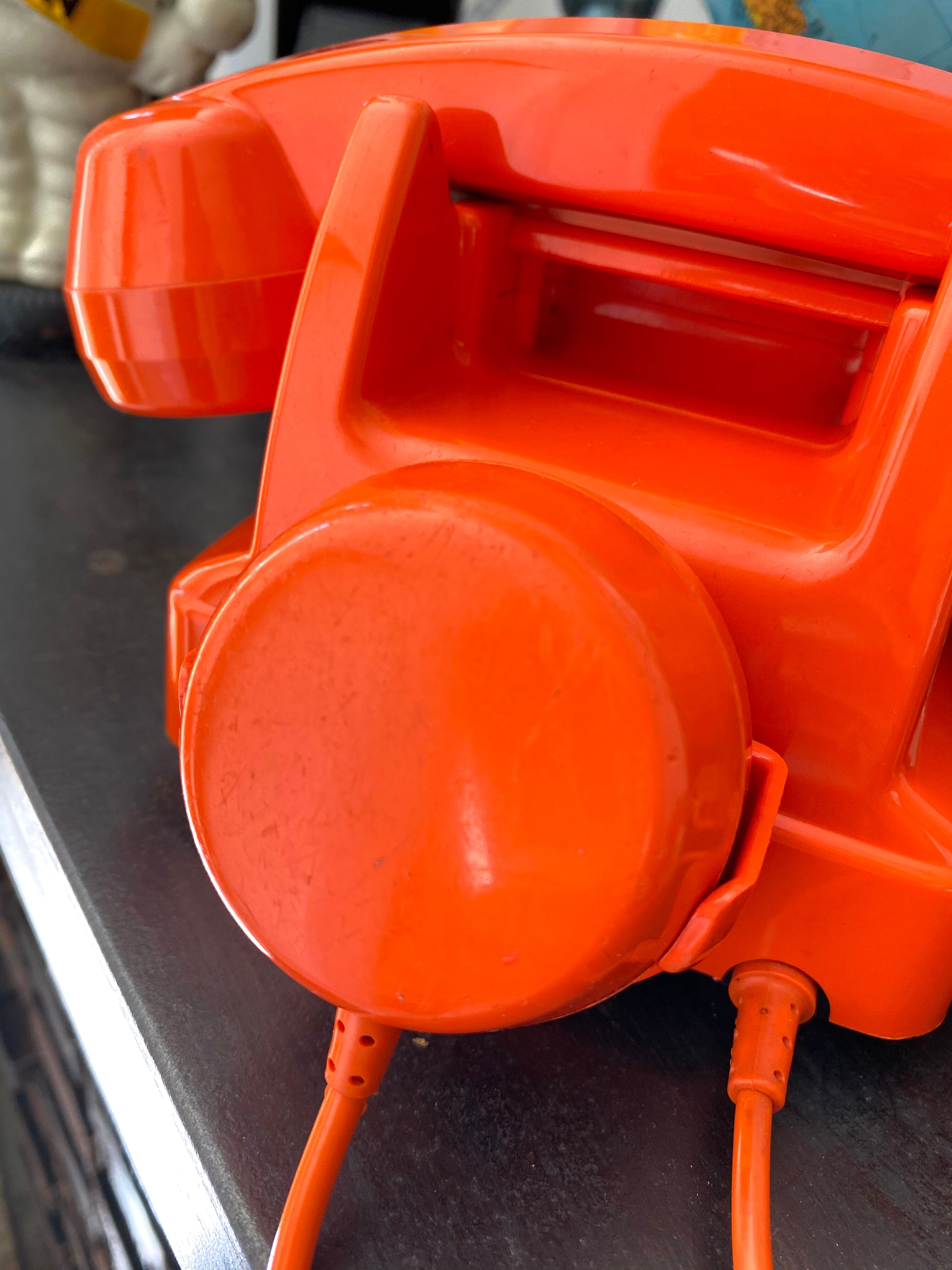 Orange vintage dial phone