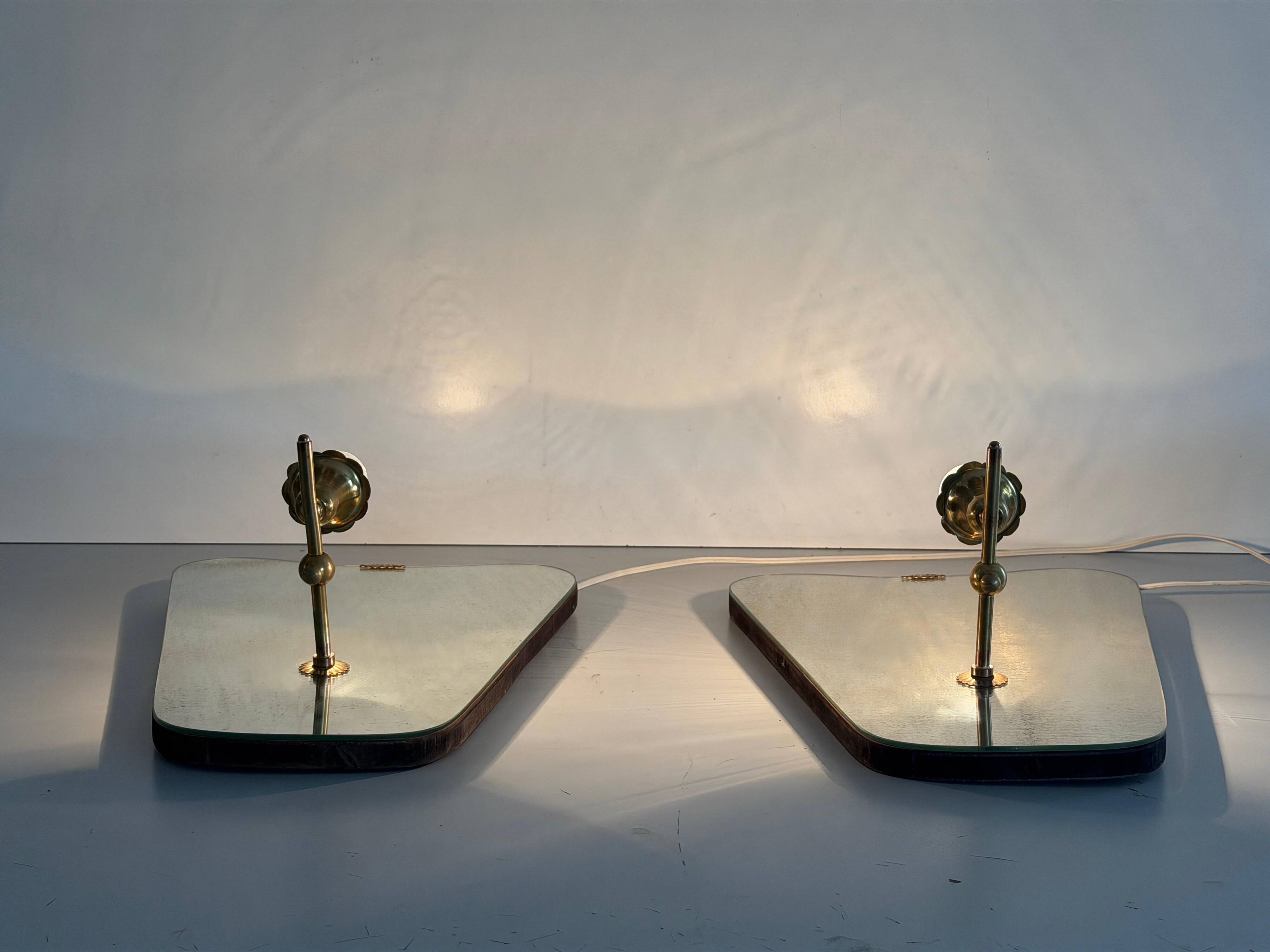 Pair of brass wall lights with mirrors, mid-20th century, Italy, 1960.