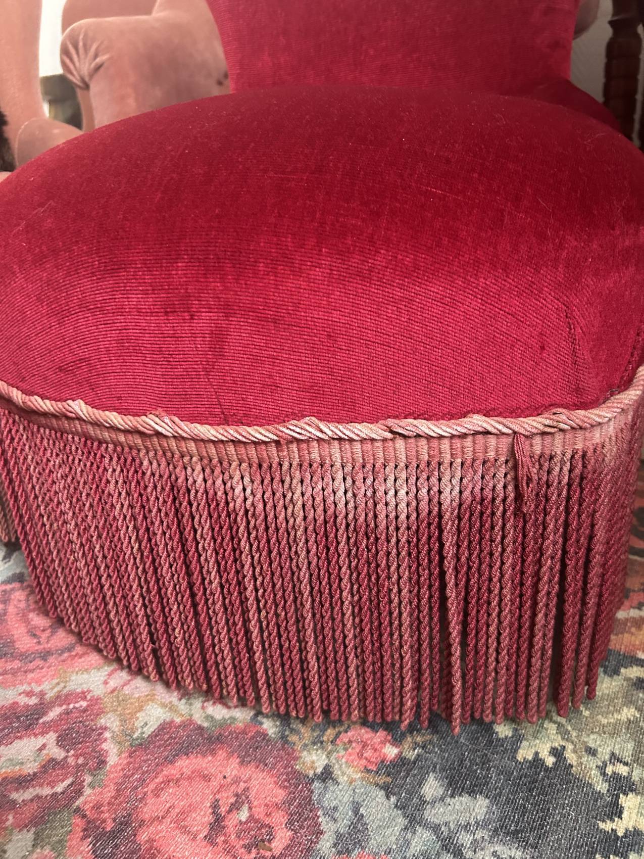 Vintage burgundy velvet armchair with fringes – theatrical and elegant