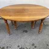 8-legged ash table with 6 extensions.