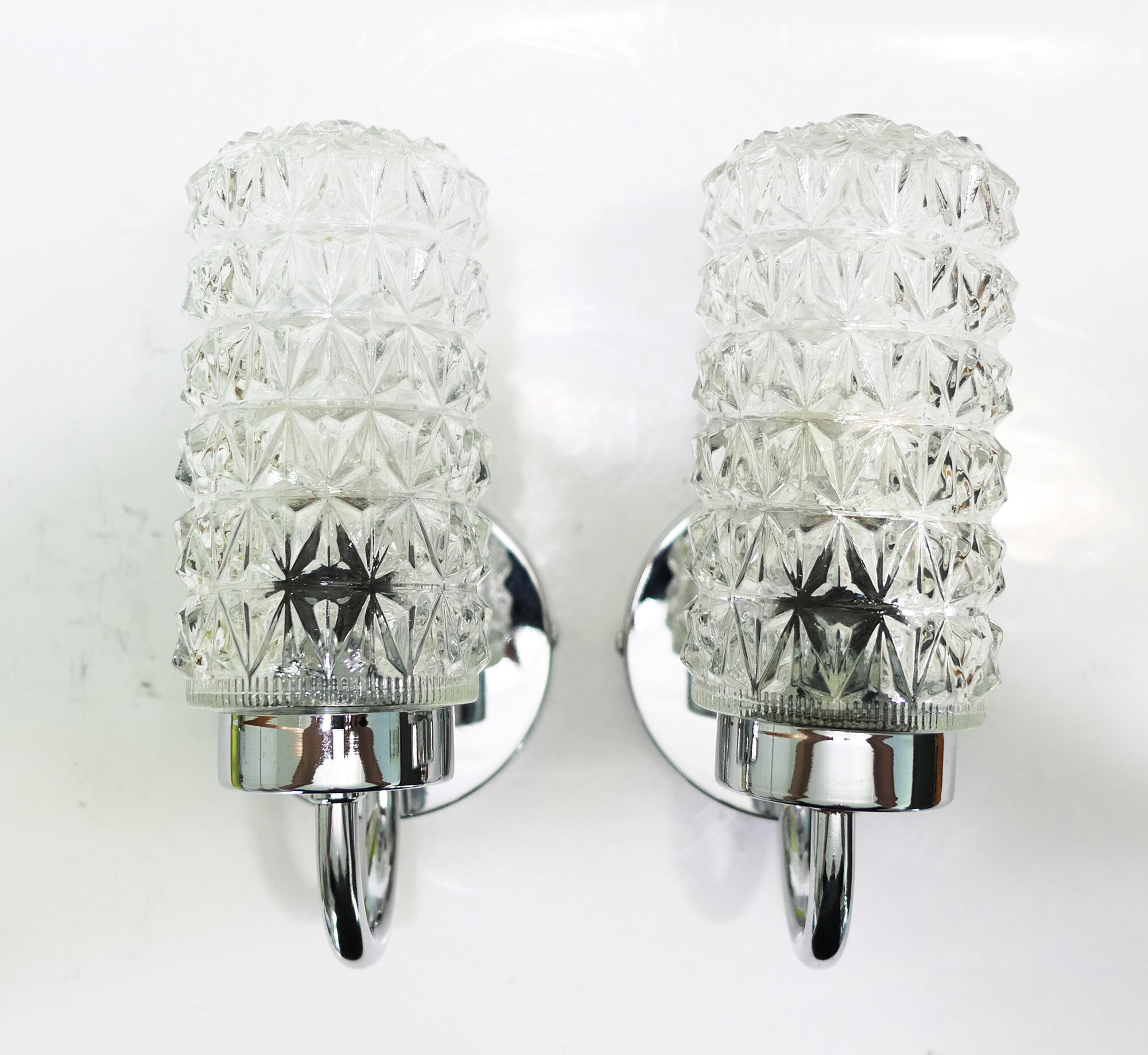 Pair of 1970 chrome metal wall light and molded glass globes.