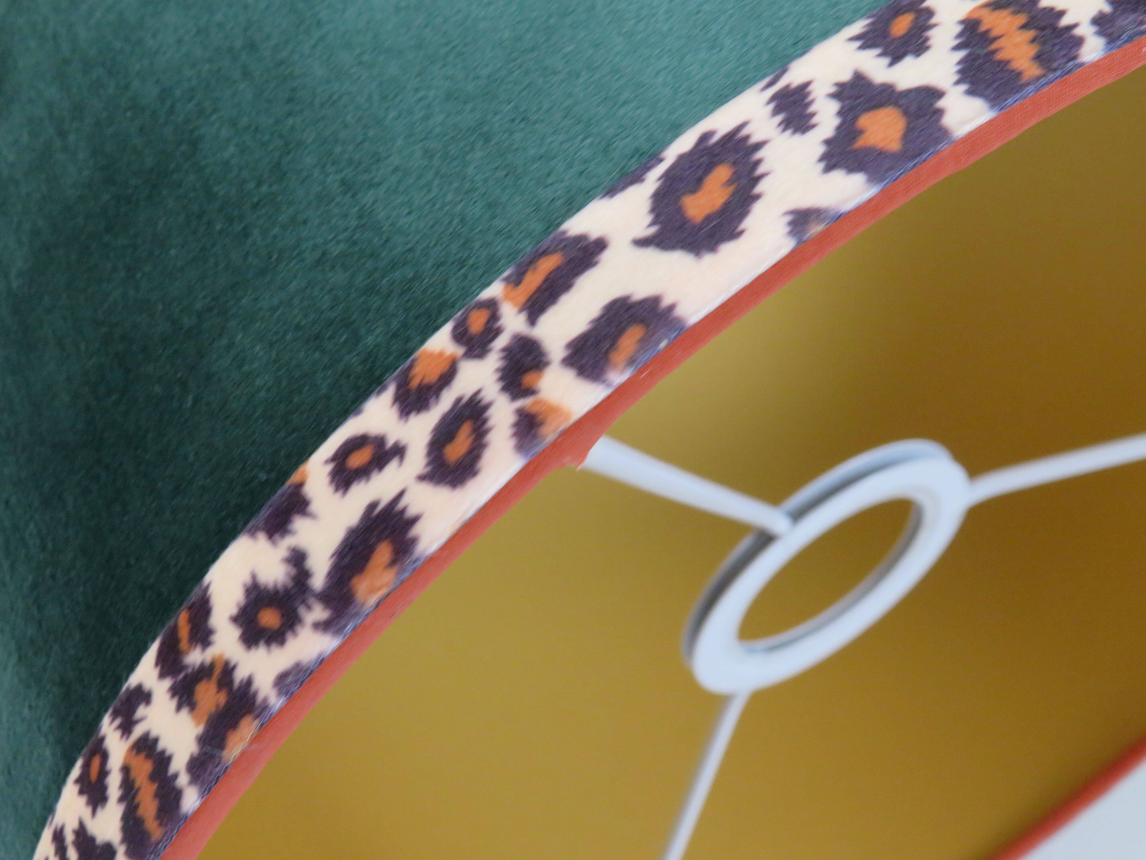 Vintage brass table lamp with green velvet shade.