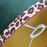 Vintage brass table lamp with green velvet shade.