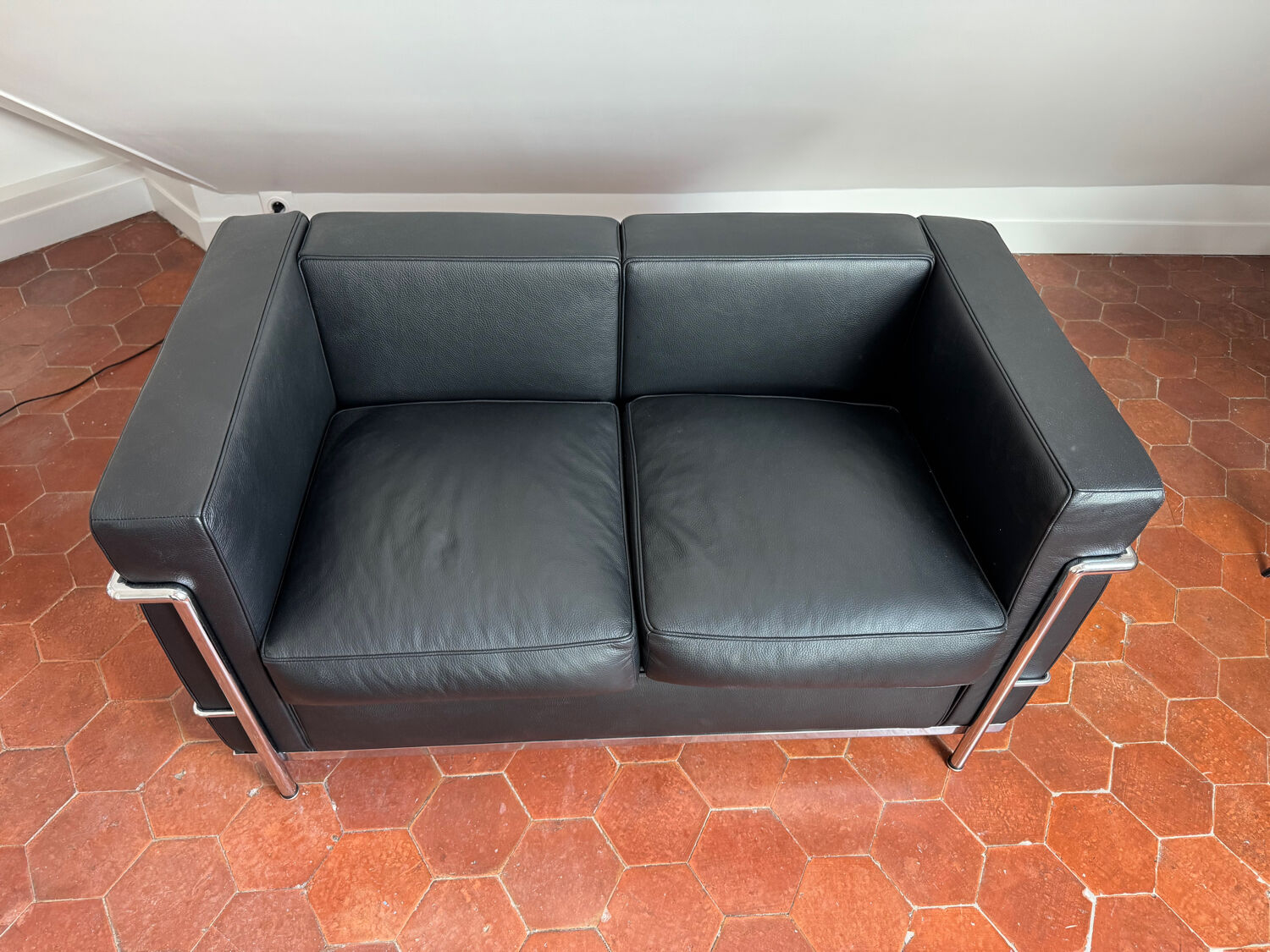 For sale: designer two-seater sofa.