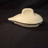 Vintage vase, geometric frieze and flowers with a black border.