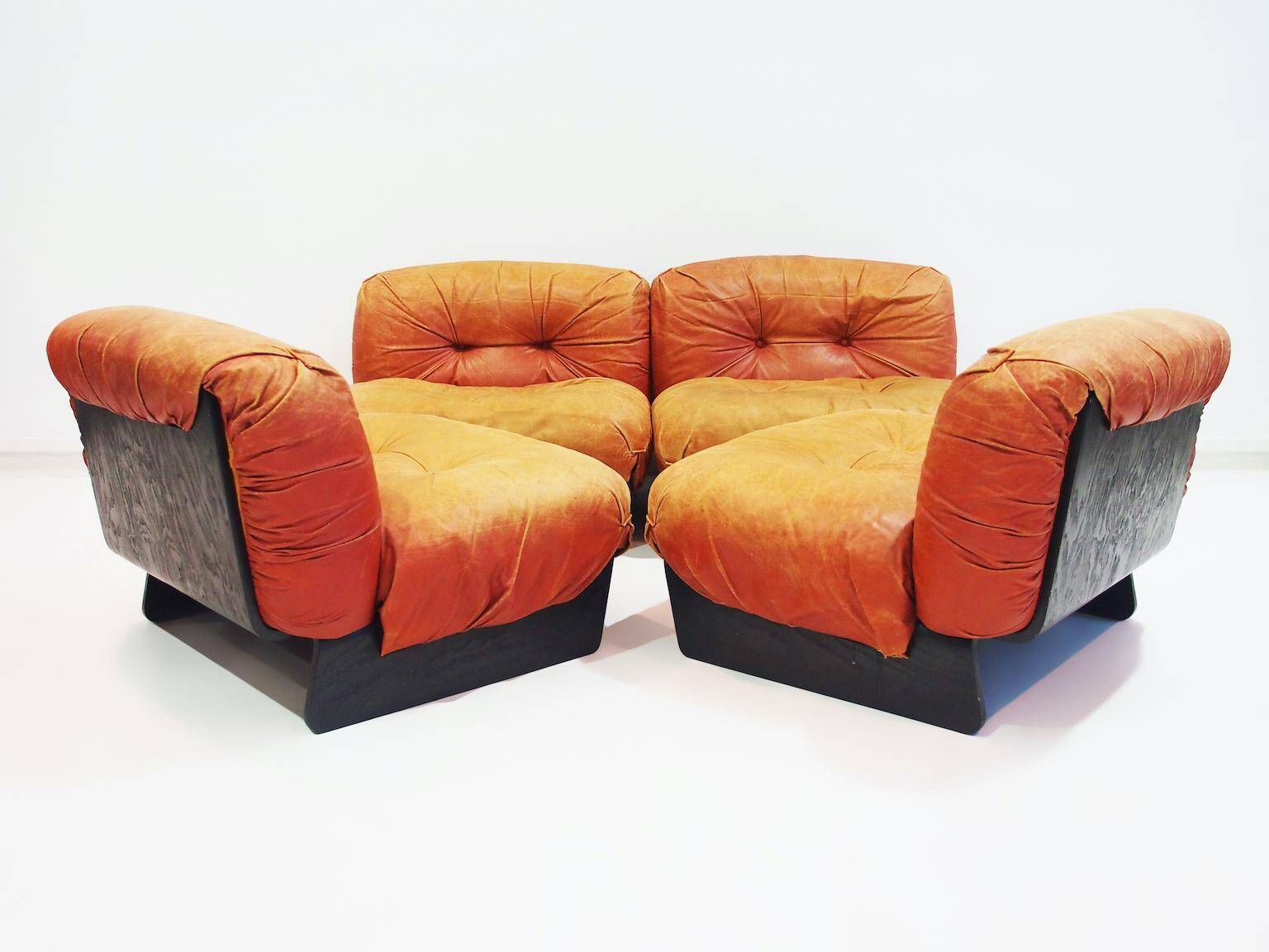 Set of four modular sun loungers by Giuseppe Munari upholstered in cognac leather.