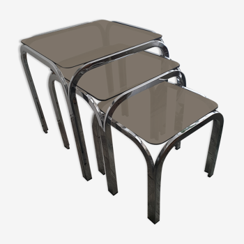 Trundle table in tubular steel and smoked glass