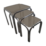 Trundle table in tubular steel and smoked glass