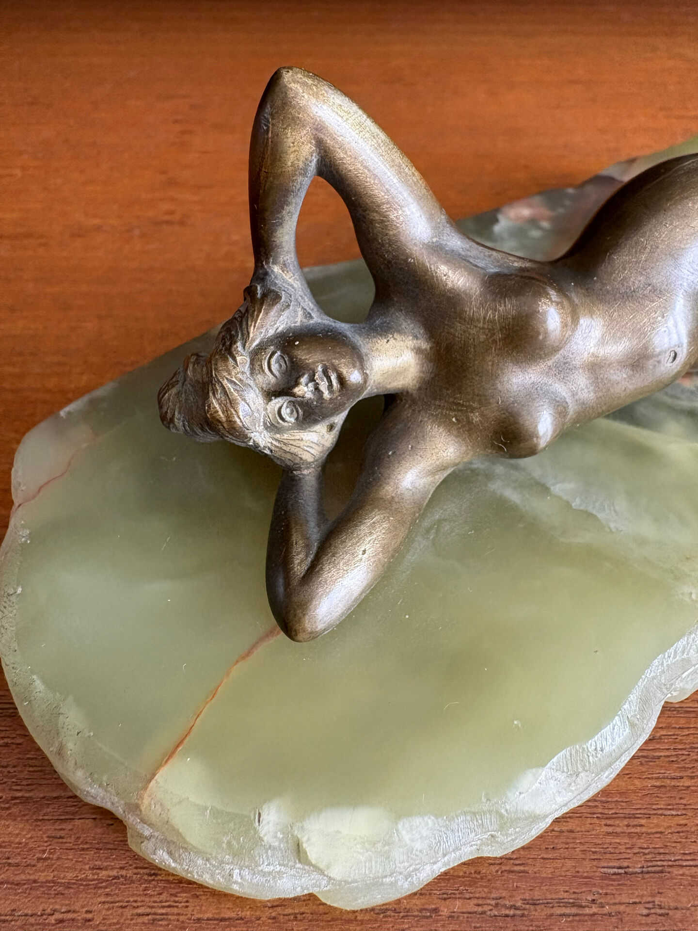 Art Deco female sculpture in bronze with onyx base.