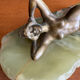 Art Deco female sculpture in bronze with onyx base.