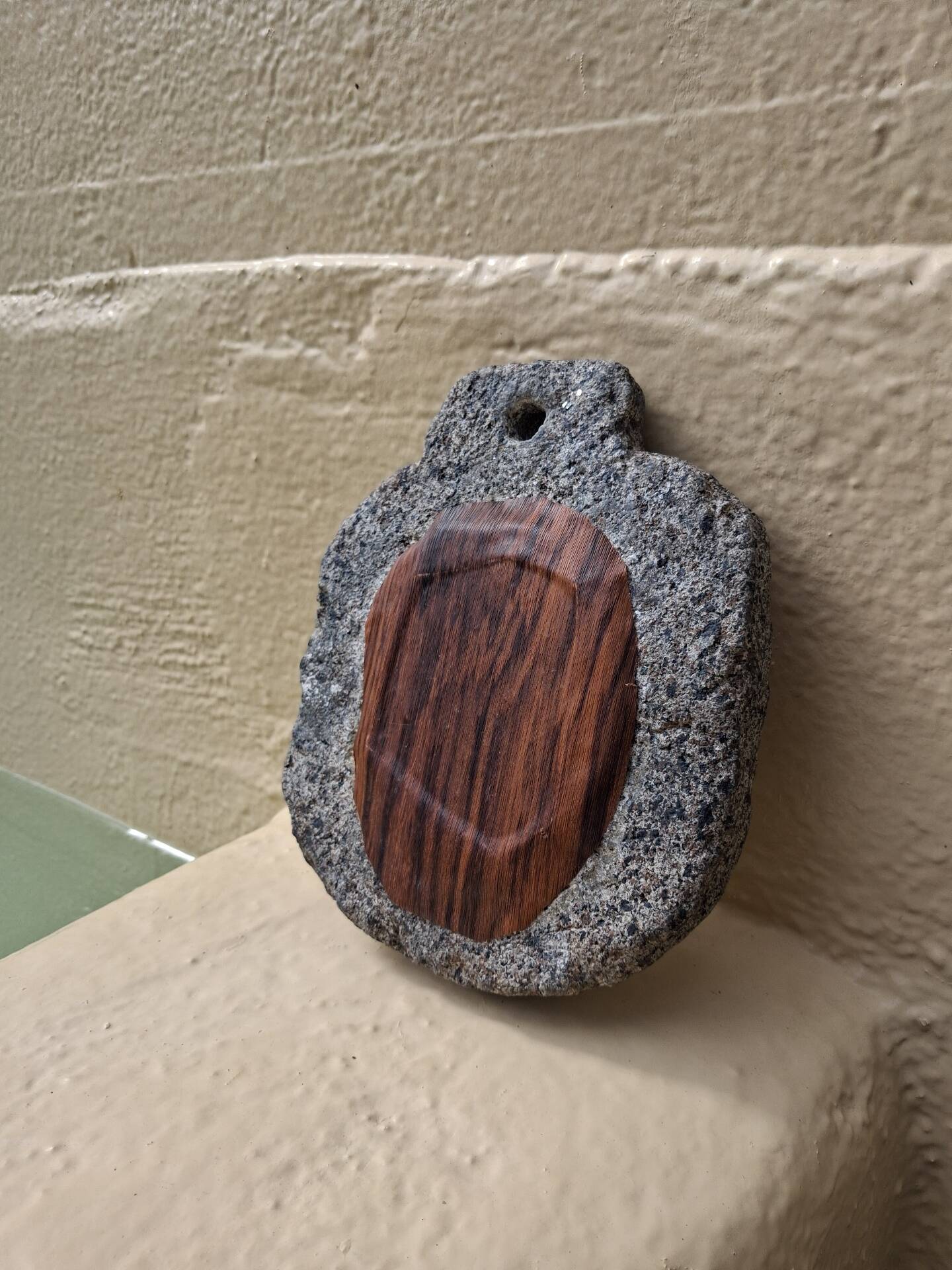 Brutalist mirror in hand-carved natural stone