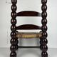 Brutalist wood turned bobbin low rush chair n the style of Charles Dudouyt