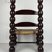 Brutalist wood turned bobbin low rush chair n the style of Charles Dudouyt